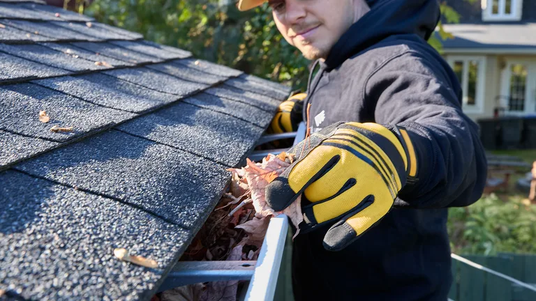 Close-up of the Alu-Rex DoublePro microfiltration continuous hanger on a shingle roof