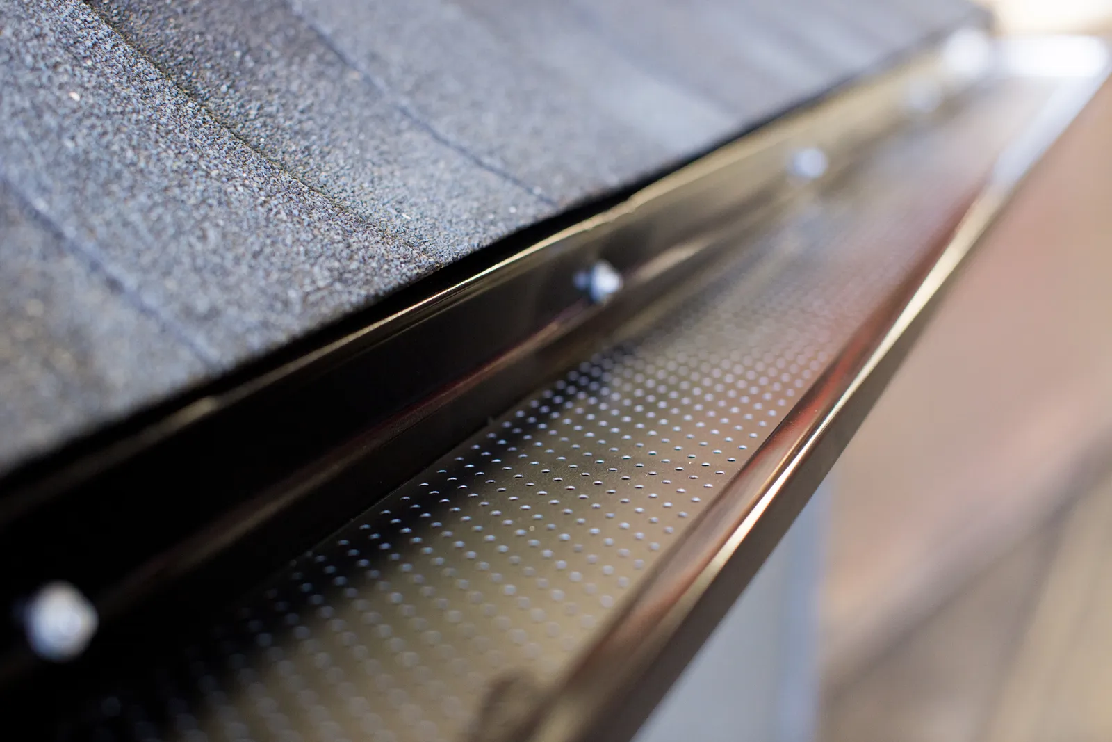 Gutter Clean System® on a metal roof gutter — Dunrite Eavestroughing, Edmonton AB